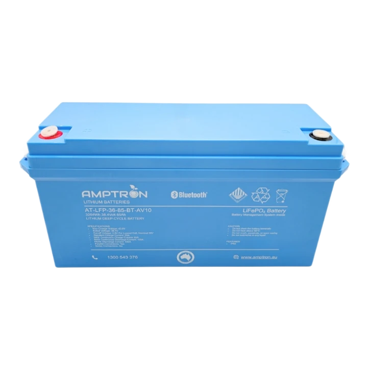 Amptron AT-LFP-36-85-BT-AV10 lithium battery face on, the blue case labelled 3264Wh 38.4 volt 85Ah lithium deep-cycle battery with Bluetooth, LiFePO4 and battery management system inside, the specification and caution panels below, and the red and black terminal covers on top