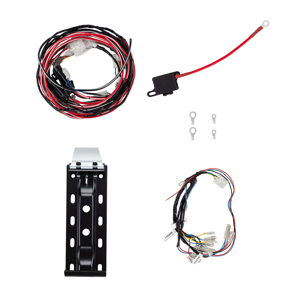 The compressor fitting kit laid out: the main wiring loom, a battery lead with in-line fuse holder and ring terminal, four ring terminals, the black powder-coated mounting bracket and the switch harness with its labelled tails