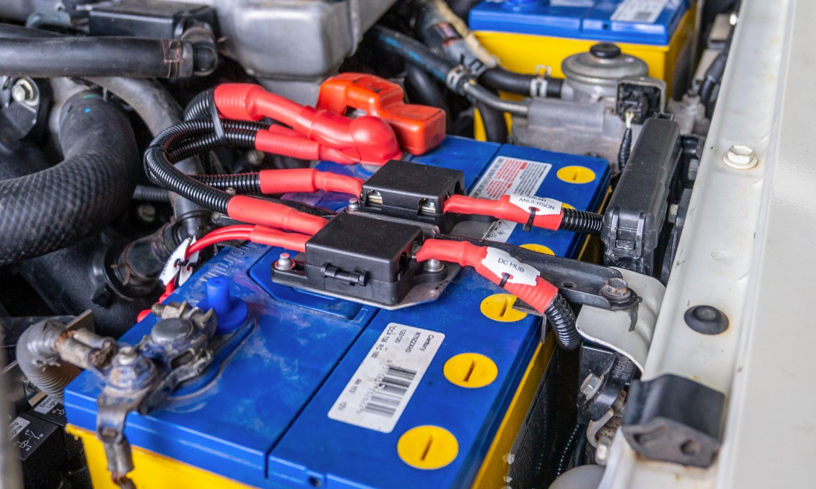 Dual battery tray inside a bonnet