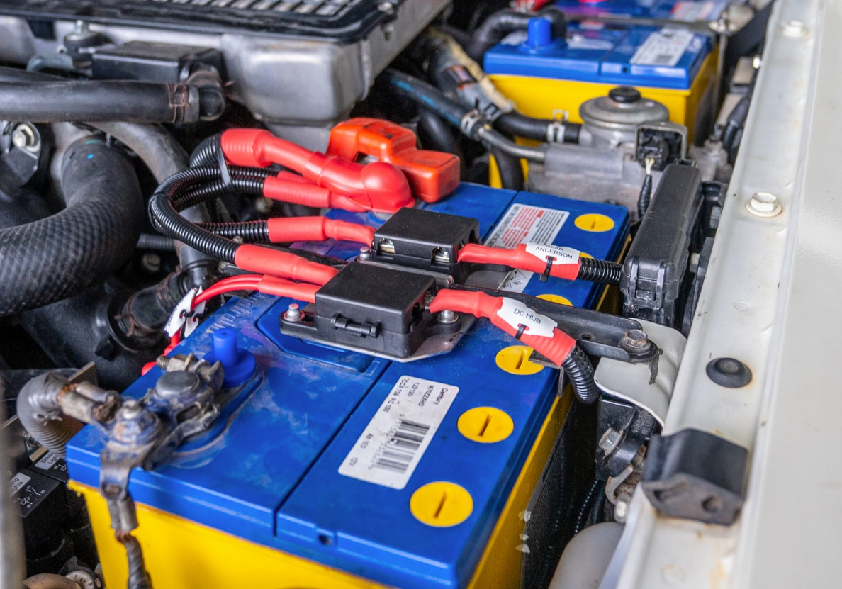 Dual battery tray inside a bonnet