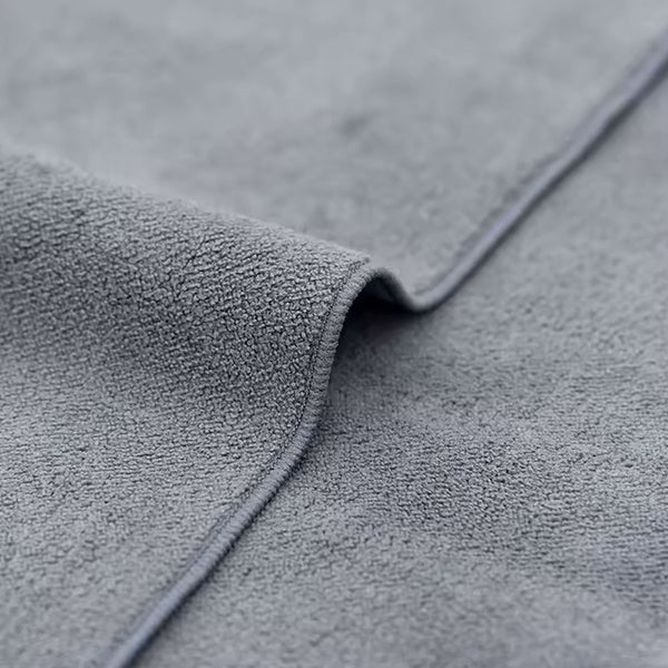 Close-up of gray textured fabric with a focus on texture and color.
