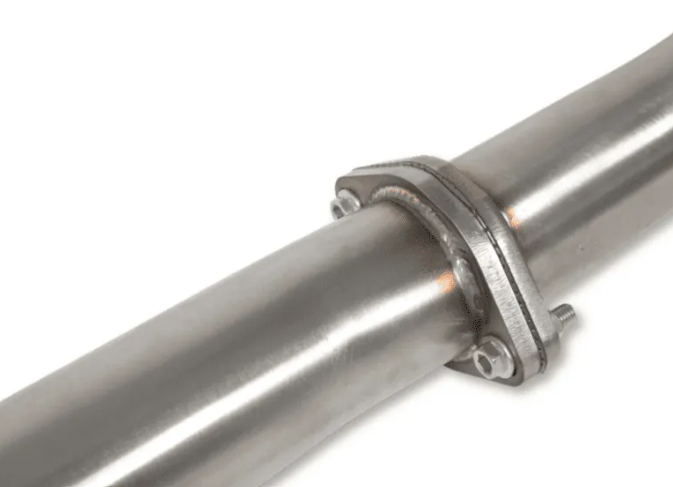 Close-up of a metal exhaust pipe with a white background