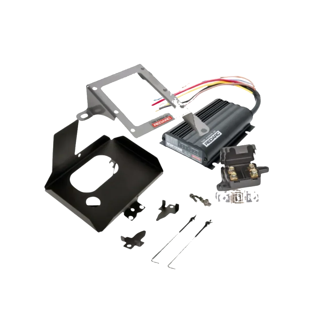 Under bonnet dual battery kit contents for the Mitsubishi Triton MQ-MR 2.4 turbo diesel, showing the REDARC BCDC1225D charger, stainless bracket, battery tray, fuses and wiring
