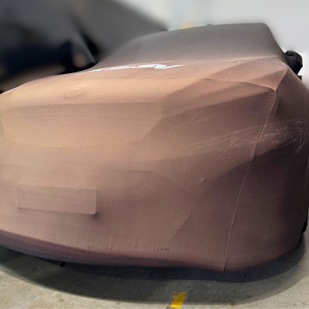 Car covered with a brown protective wrap