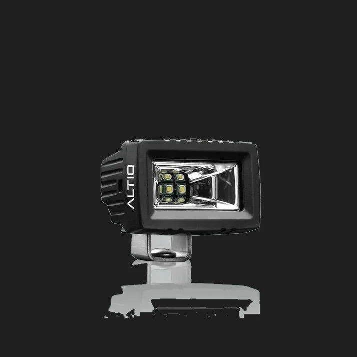 ALTIQ CX2 work light face on, the ALTIQ name on the left cheek of the housing and a rectangular reflector holding a block of six LEDs