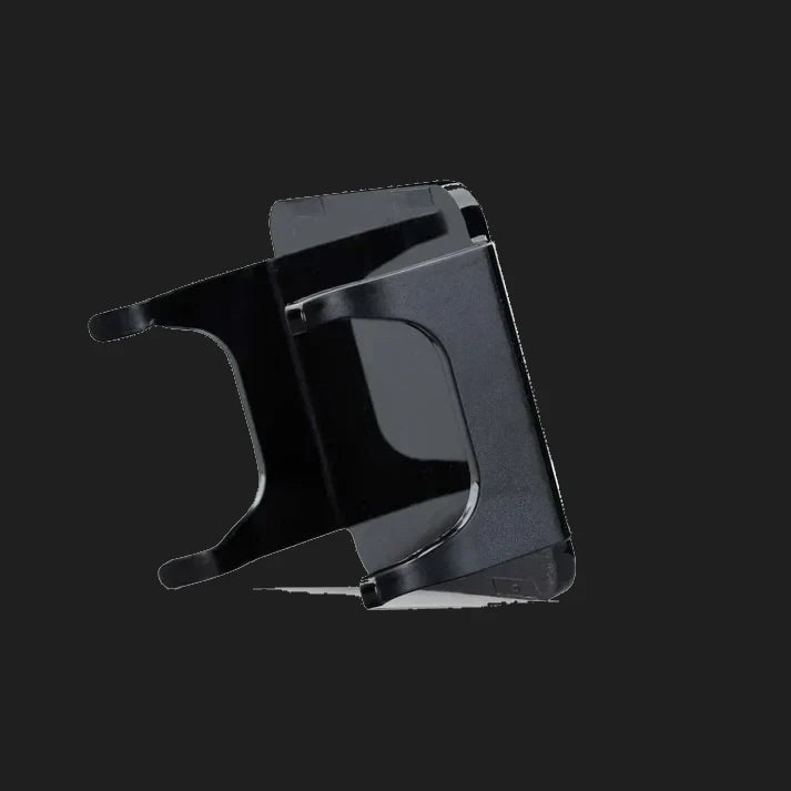 Black DX4 blackout cover seen edge on from behind, showing the depth of the skirts and the clips that hook over the light housing