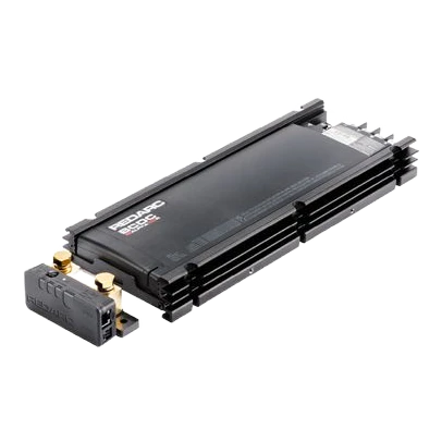 The Alpha100 R from the opposite corner, showing the depth of the extruded heatsink fins and the row of connectors along the far edge, with the sense module in the foreground