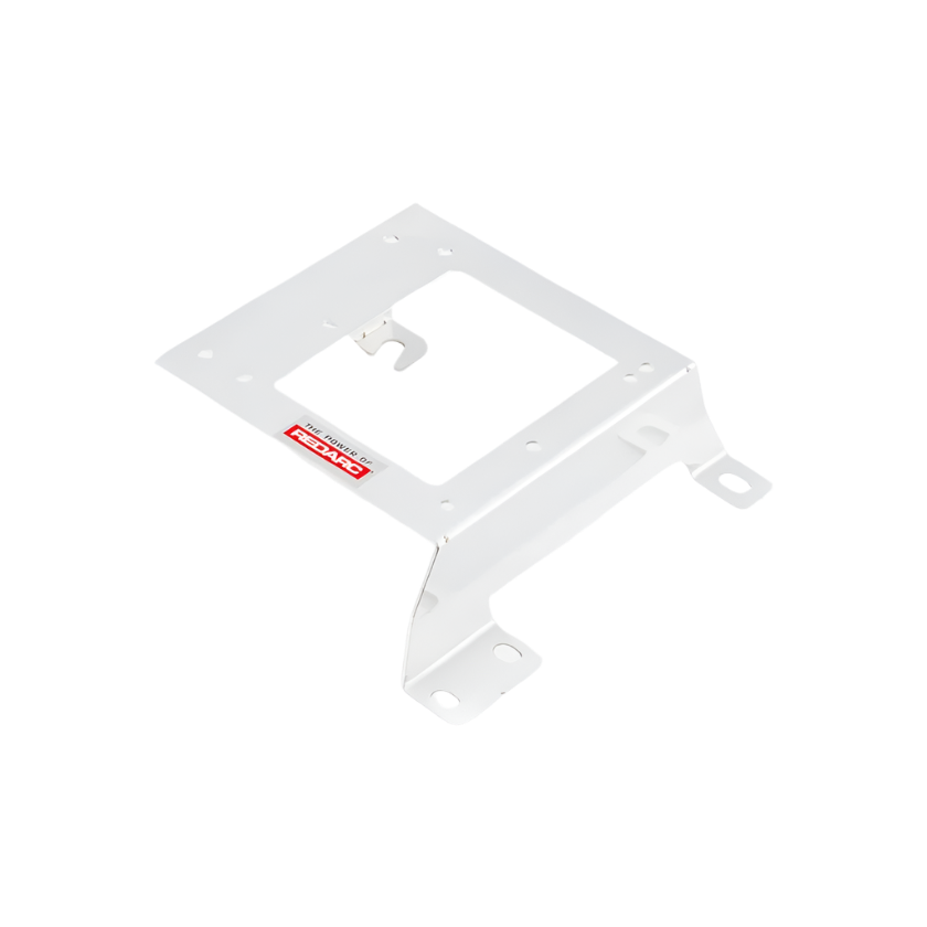 White Redarc mounting bracket seen from a low angle, the cut-out plate with a hooked tab and two slotted feet turned toward the camera