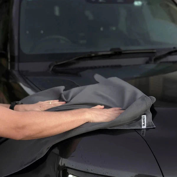 Person using Microfibre Drying Towel on a vehicle
