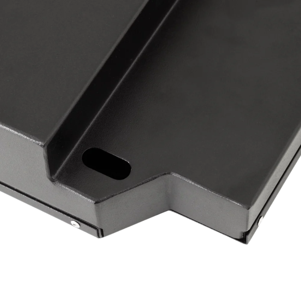 Close-up of the folded steel edge of the battery case, showing the slotted mounting hole, the powder-coated finish and the countersunk fixing along the seam