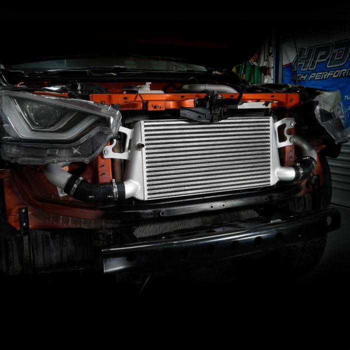 Car radiator on a car in a garage setting