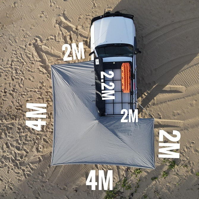 Measurement chart of a large gray tarp on sandy ground