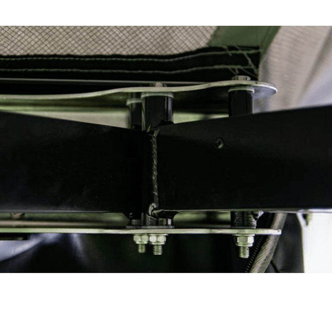 Close-up of a metal frame structure with bolts and straps.
