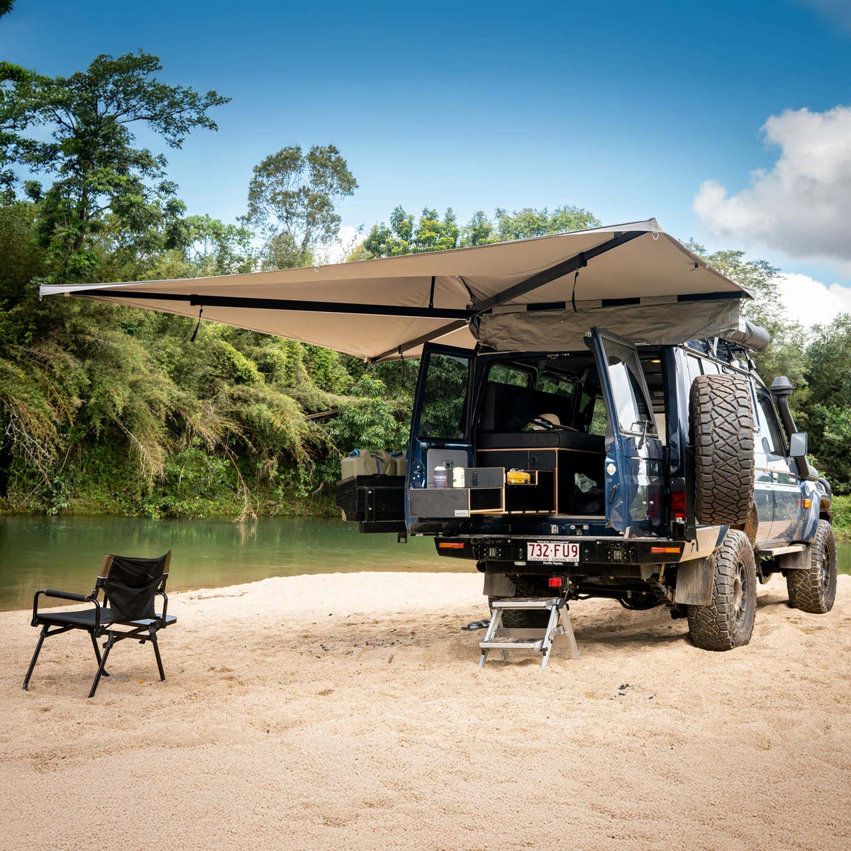 Destination 4WD D270 freestanding 270 degree awning set up on a 4WD at a riverside camp