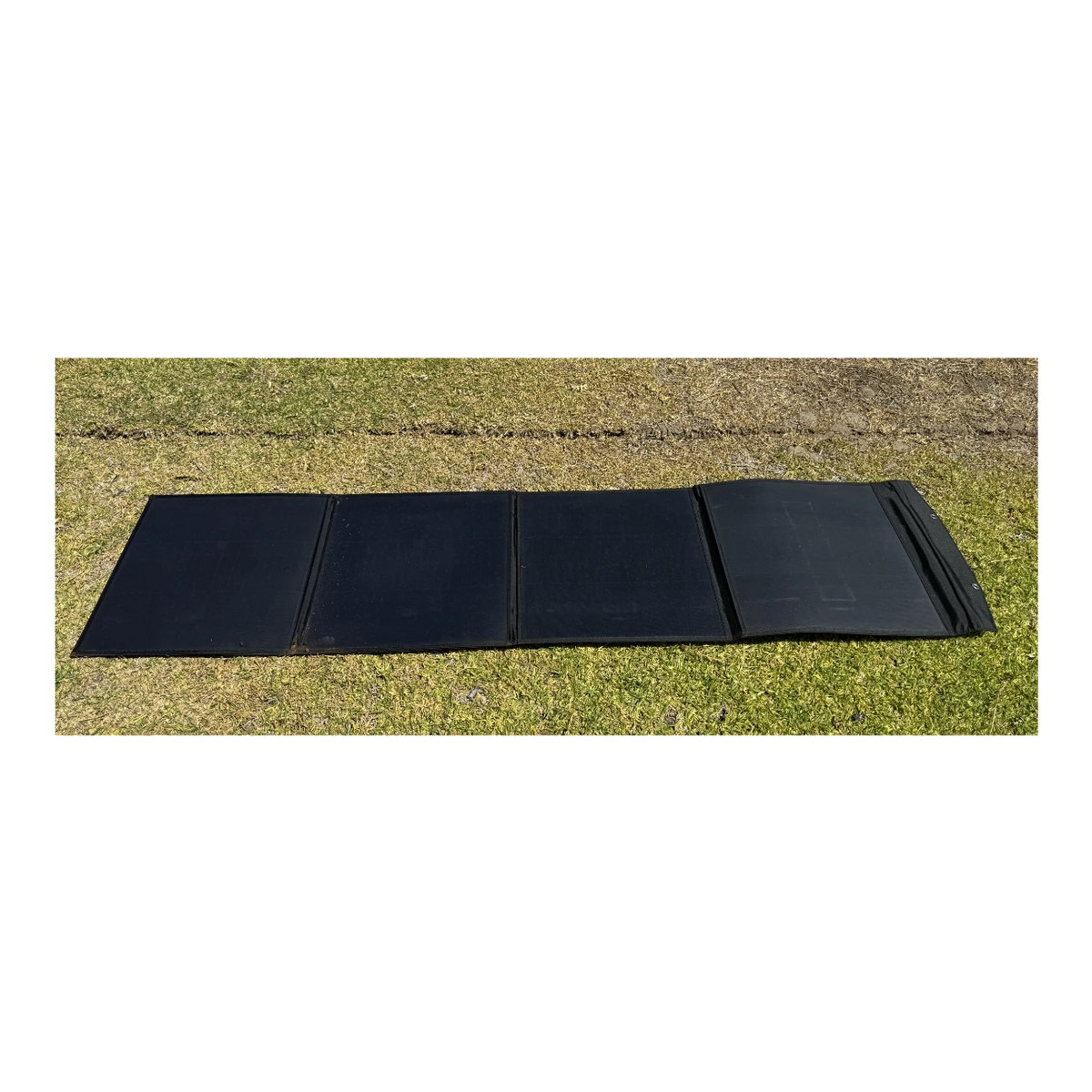 Black solar blanket on grass – Elevate Automotive 200W 50V Solar Blanket