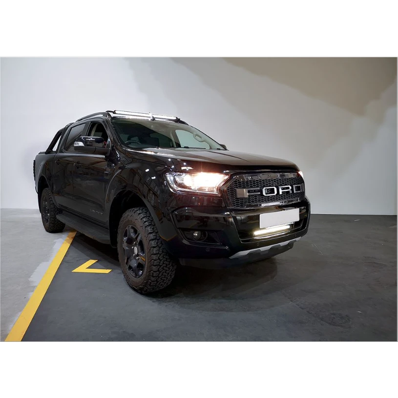 Black Ford truck parked indoors with a white wall background with Lazer Lamps Bumper Beam Mount Kit – Ford Ranger (2016–2022)