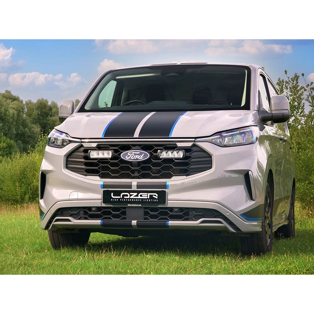 Ford Transit Custom Sport (2024+) Grille Kit – white Ford Transit van with black and blue stripes on a grassy field