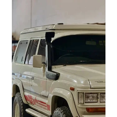 White off-road vehicle with red graphics on a white background – Headspace Roof Conversion LC60