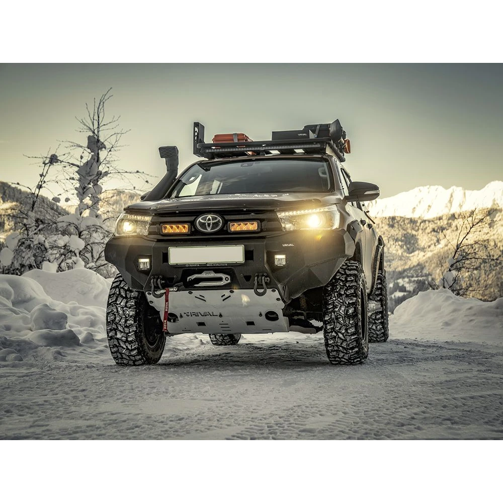 Toyota truck with off-road equipment in a snowy landscape