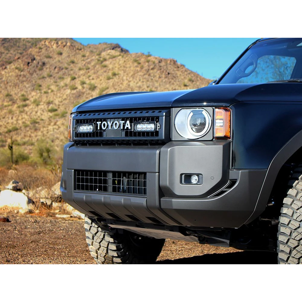 Close-up of a blue Toyota vehicle in a desert setting