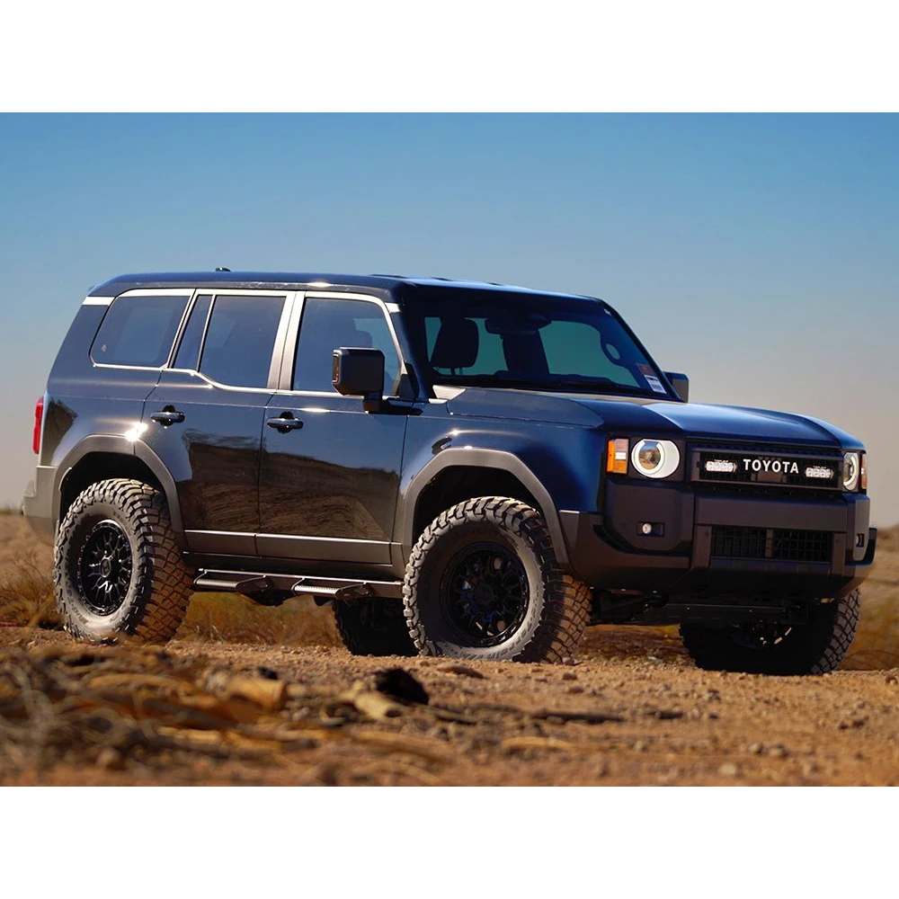 Toyota Prado 250 SUV on a dirt road with a clear blue sky