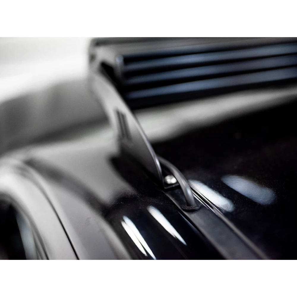 Close-up of a car's grille with a blurred background
