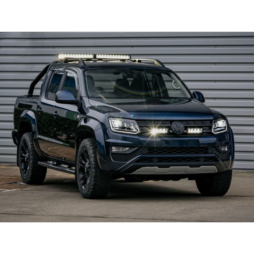 Black Volkswagen Amarok pickup truck with additional lights on a gray background with Lazer Lamps Grille Kit for VW Amarok V6 (2016–2022)