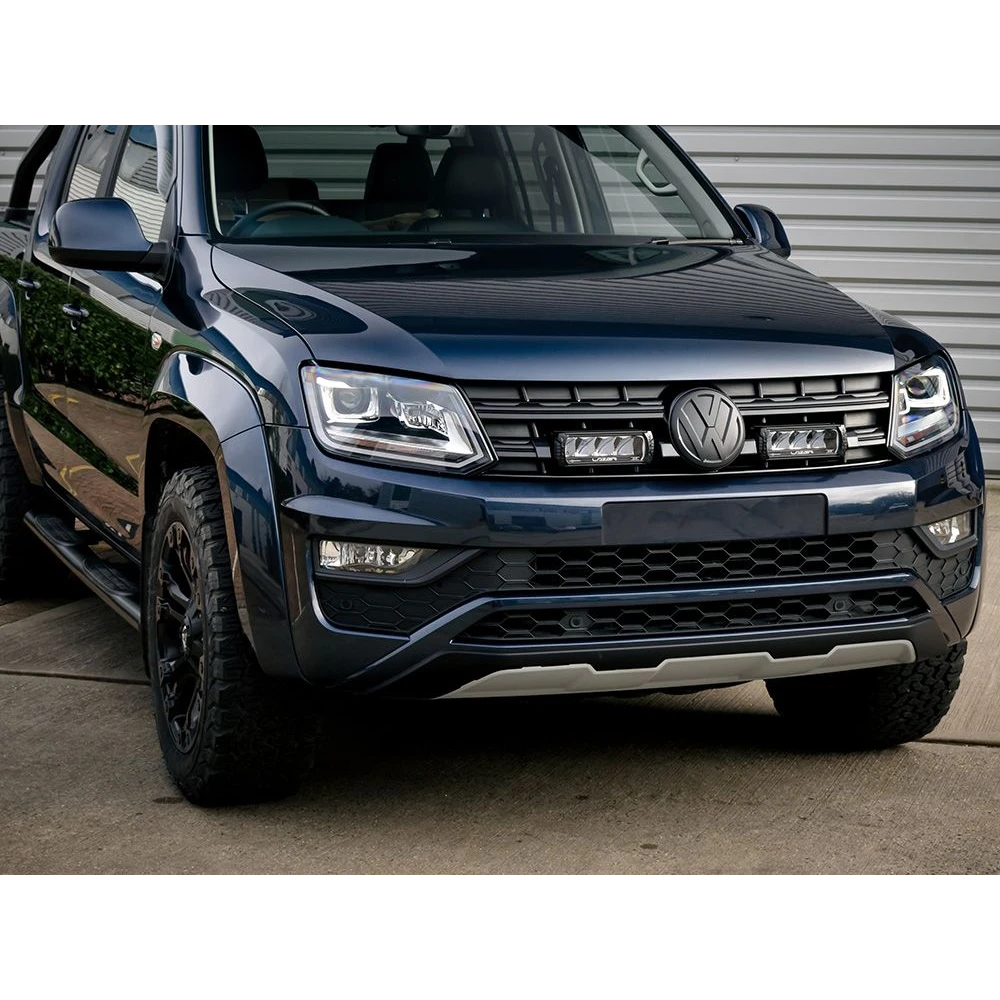 Front view of a black Volkswagen SUV parked on a concrete surface.