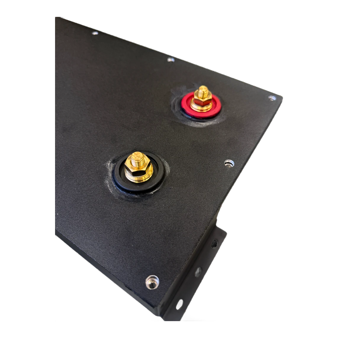 Close-up of the compartment lid showing the red positive and black negative terminal studs, each brass stud sealed through the plate with a rubber grommet – Lithium Battery Compartment