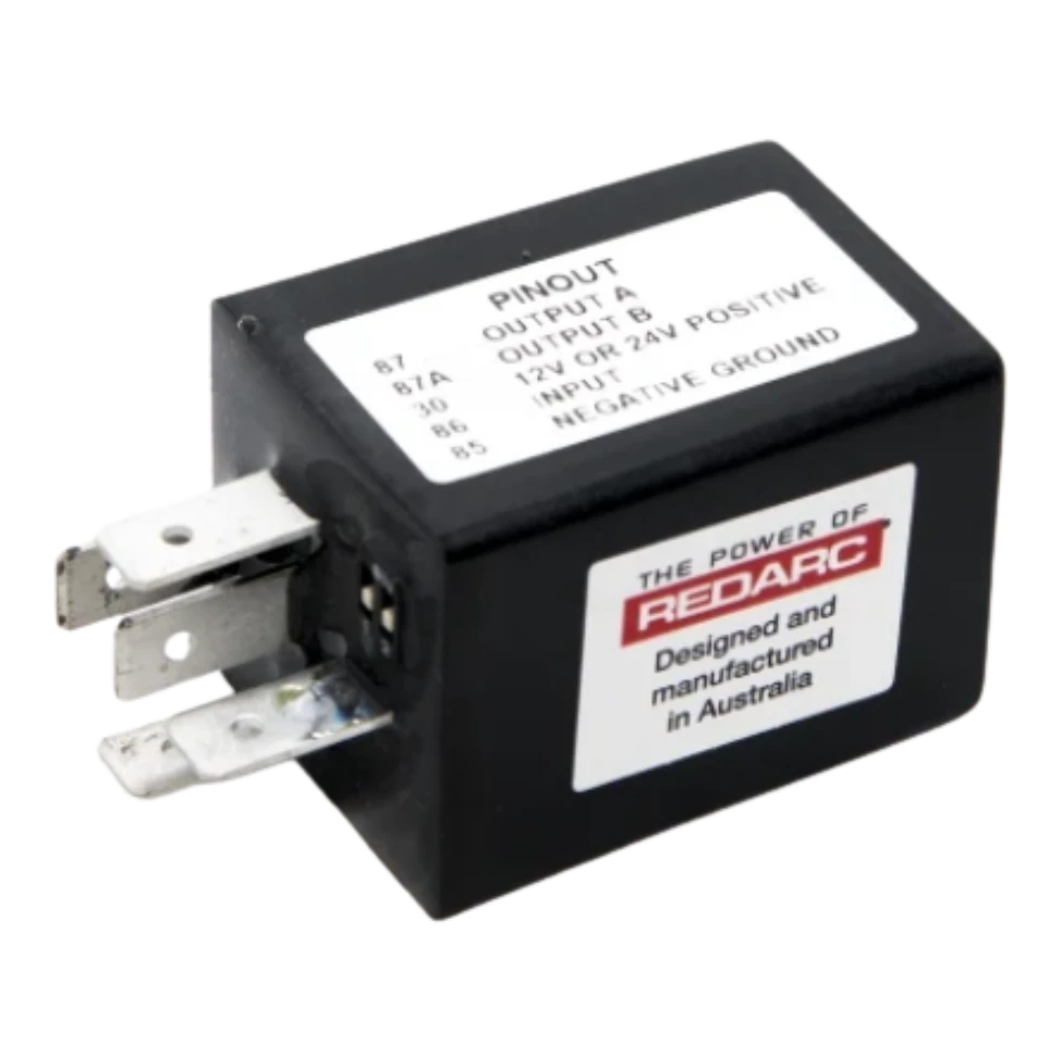 Redarc CR1224L latching chopper relay. Compact sealed black thermoplastic housing with a standard 5-pin ISO relay base. Two latched outputs (pins 87 and 87a) that alternate on each momentary push-button pulse into pin 86. Made in Lonsdale, South Australia