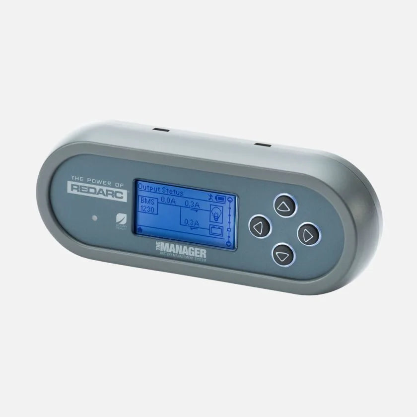 REDARC Manager30 battery monitor display showing the output status screen with charge current readings and navigation buttons