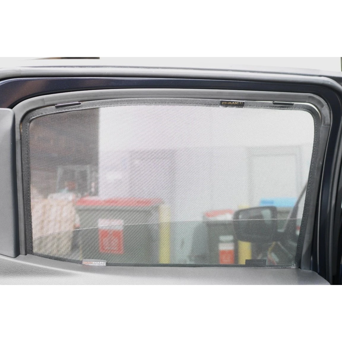 SnapShades Rear Window Shades Isuzu D-MAX RG – shade fitted to a rear side window, seen from outside