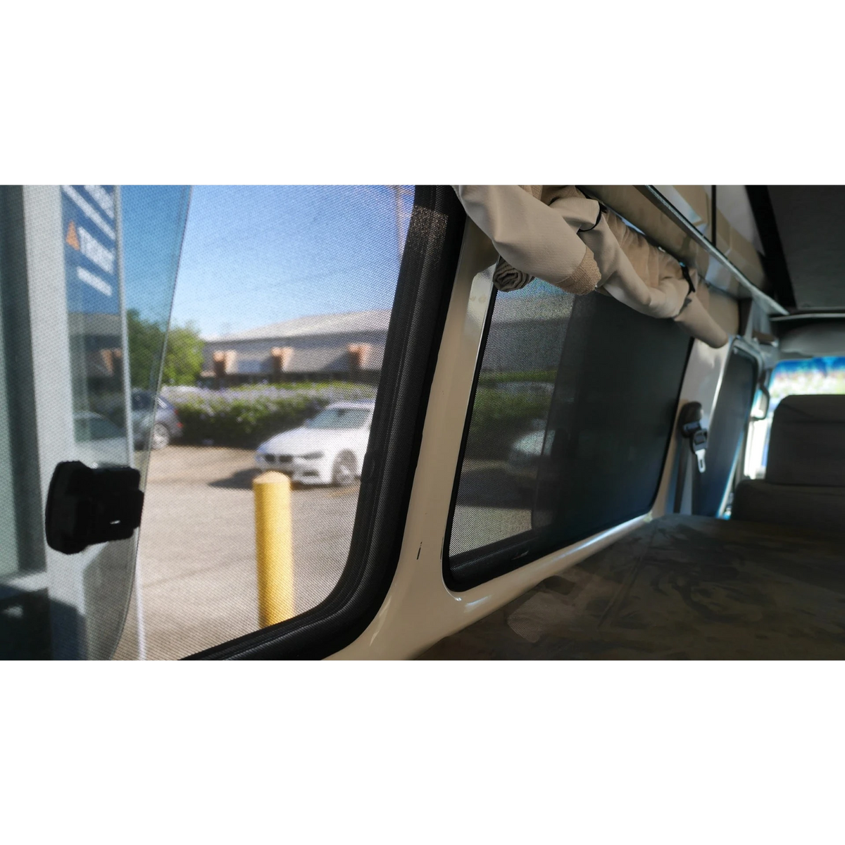 Interior view of a side window with SnapShade fitted – SnapShades Second Row Side Port Windows Suit 75/78 Troopcarrier