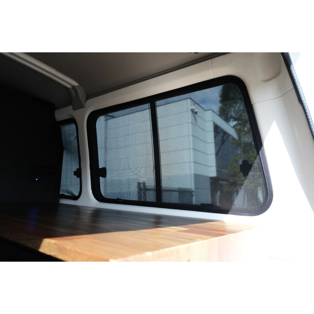 Troopcarrier rear interior with third row window shade fitted – SnapShades Third Row Side Port Windows Suit 75/78 Troopcarrier