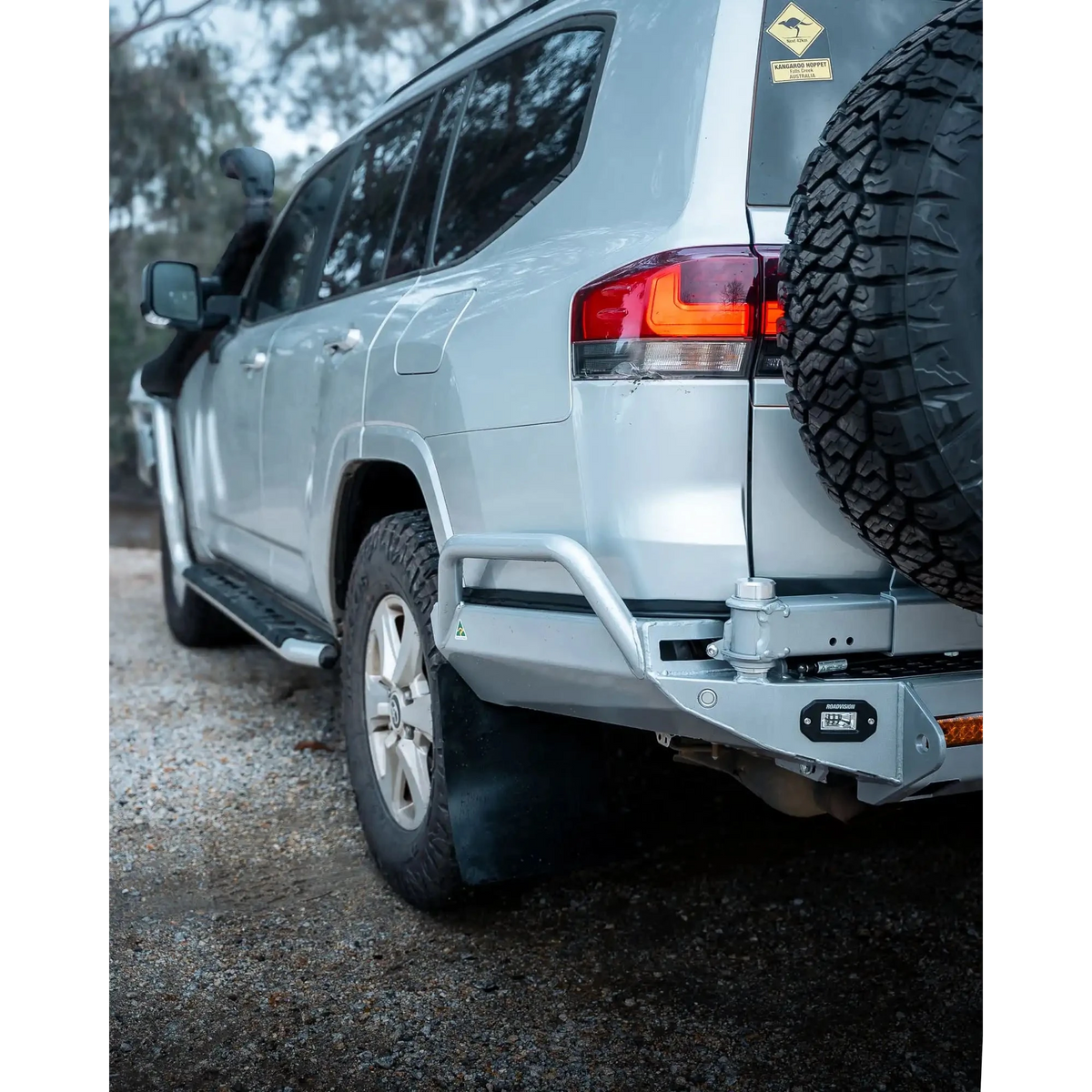 Silver SUV with off-road tire and bumper on a gravel surface – TCC Toyota LC300 Series Rear Bar