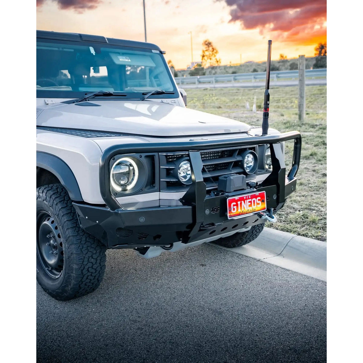 White off-road vehicle with a sunset in the background – TCC Ineos Grenadier Bull Bar