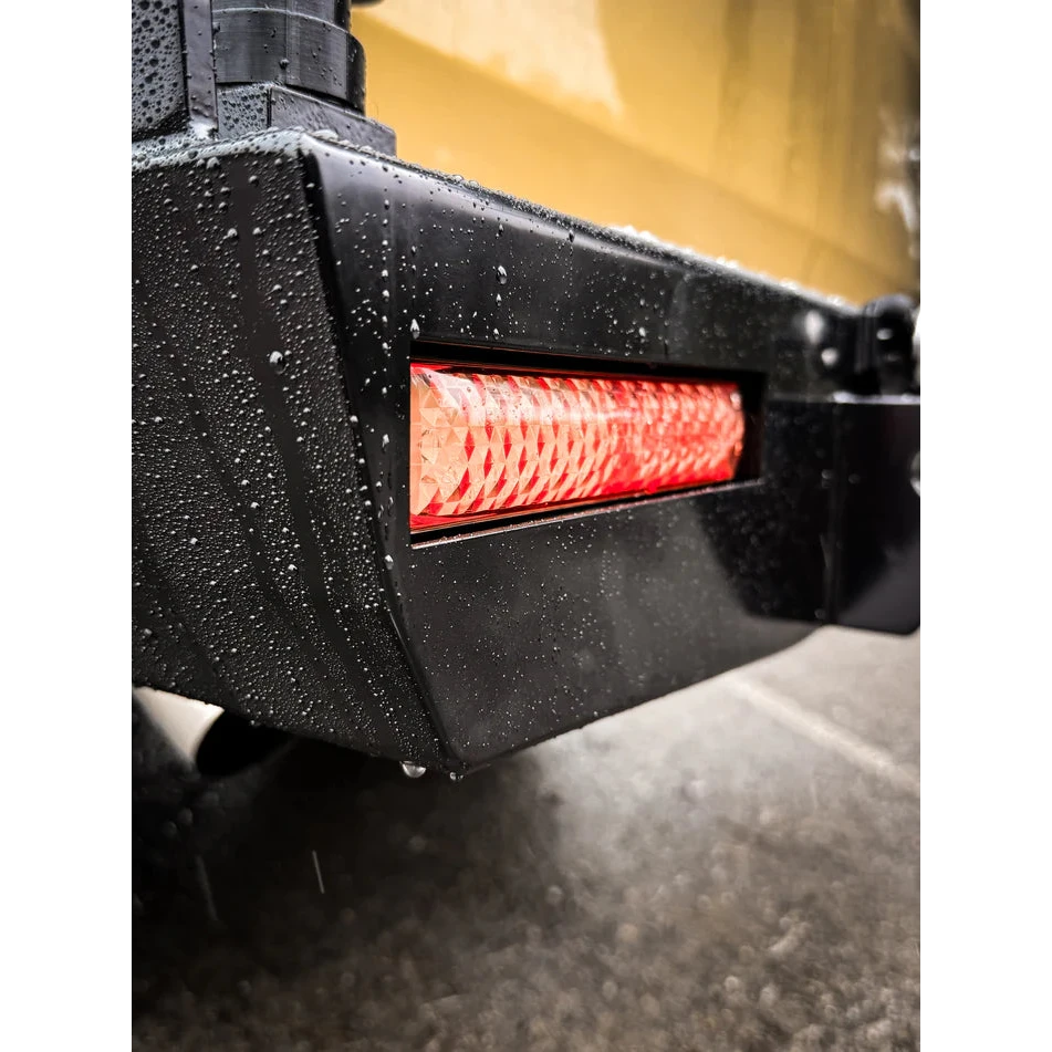 Thorburns LC75/78 Rear Bar – close-up of a black vehicle bumper with a red LED light