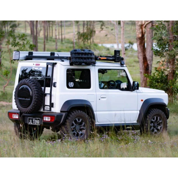 White Suzuki Jimny with roof rack and spare tyre – Torqit 2.5″ Performance Exhaust for 1.5L Suzuki Jimny 04/2019+
