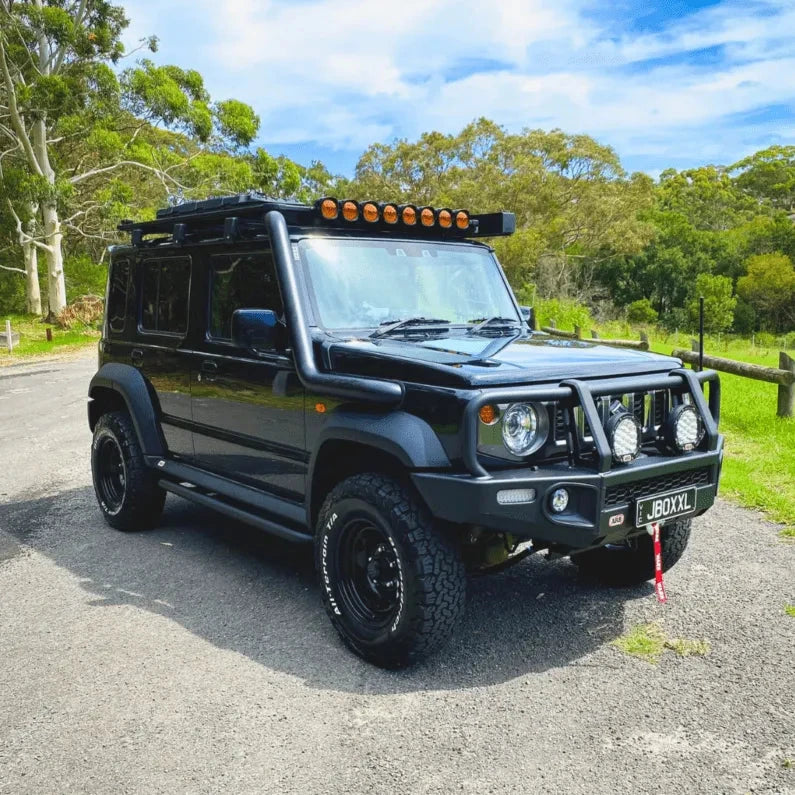Black Suzuki Jimny with snorkel on a bush road – Torqit 3.5" Stainless Steel Snorkel (Matte Black) for Suzuki Jimny (JB74 / JC74 XL)