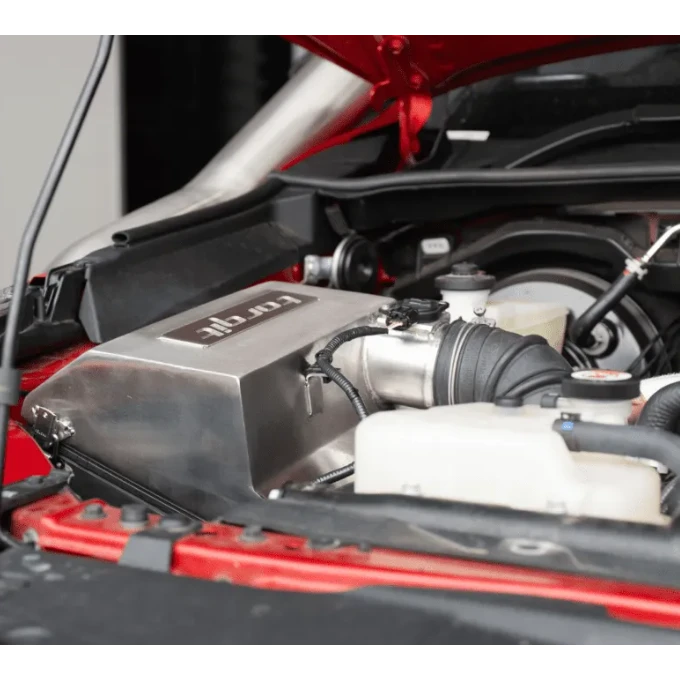 Close-up of the Torqit airbox branding in the engine bay – Torqit Stainless Steel Airbox (Matte Black) for Toyota Hilux 2.8L