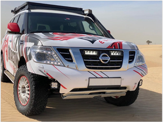 Nissan vehicle with a colorful wrap on a desert background