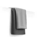 Gray towel with 'BLAHST' branding on a white background