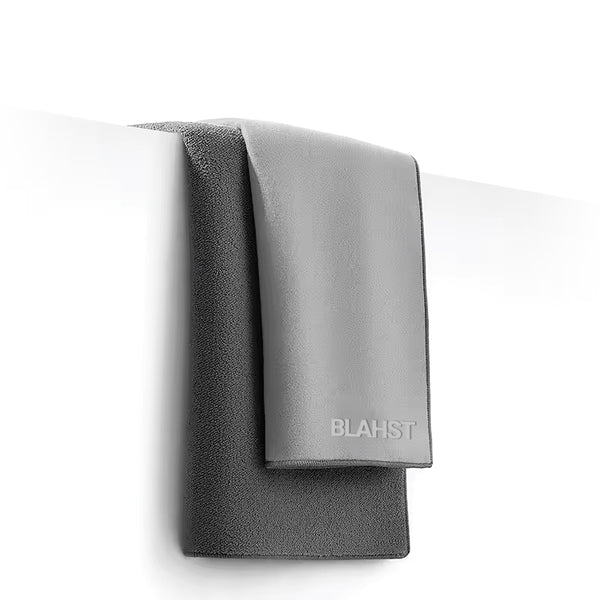 Gray towel with 'BLAHST' branding on a white background
