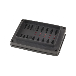 Weatherproof fuse block at an angle with the lid removed, showing two rows of blade fuse terminals, the row of red indicator LEDs between them, the sealing groove around the rim and the corner mounting holes