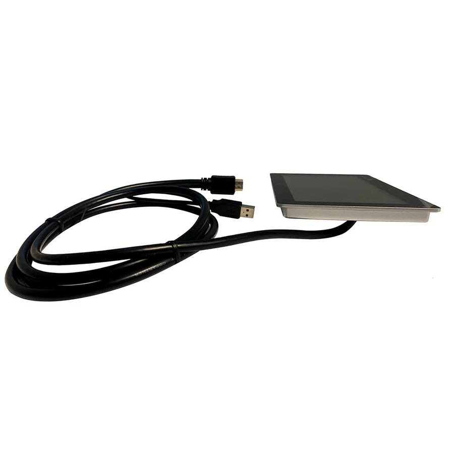 Victron GX Touch 50 seen at a low angle showing how thin the flush-mount panel is, with its stainless bezel and the supplied USB and HDMI lead coiled alongside