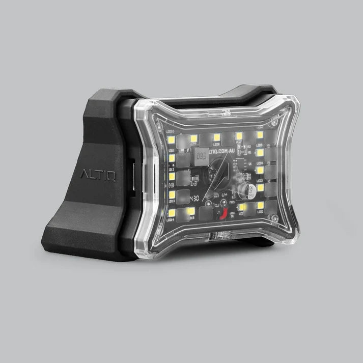 ALTIQ 30 degree angle mount fitted behind a Spectrum Pro rock light, the black moulded wedge carrying the ALTIQ name with the light seated on its face