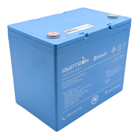 Amptron 12V 100Ah LiFePO4 battery in its blue case seen from the front corner, with the recessed terminals under their covers, the Bluetooth marking and the specification panel down the front face