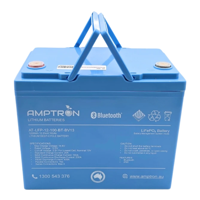 Amptron AT-LFP-12-100-BT-BV13 battery face on with the carry handle raised, the label listing 1280Wh, 12.8 volts, 100Ah, max charge voltage 14.6V, standard charge current 20A, max continuous charge 100A, max continuous discharge 200A, peak discharge 400A, parallel connections yes and series connections up to four