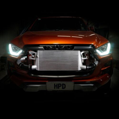 Orange car with a prominent intercooler on a dark background