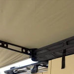 Close-up of a tent roof with a metal bracket and 'The Bush Company' logo.